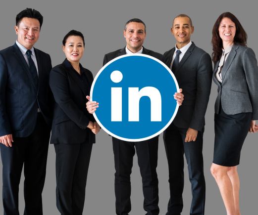 https://sociallyin.com/wp-content/uploads/2024/09/business-people-holding-linkedin-logo-1.png