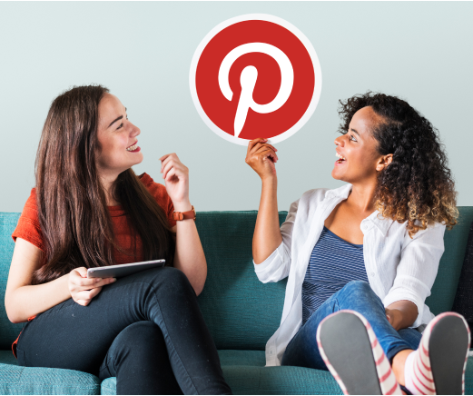 https://sociallyin.com/wp-content/uploads/2024/10/young-women-showing-pinterest-icon.png