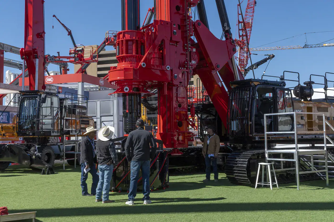 Attendees looking up at a red SANY drilling rig on the Festival Grounds at CONEXPO-CON/AGG 2026